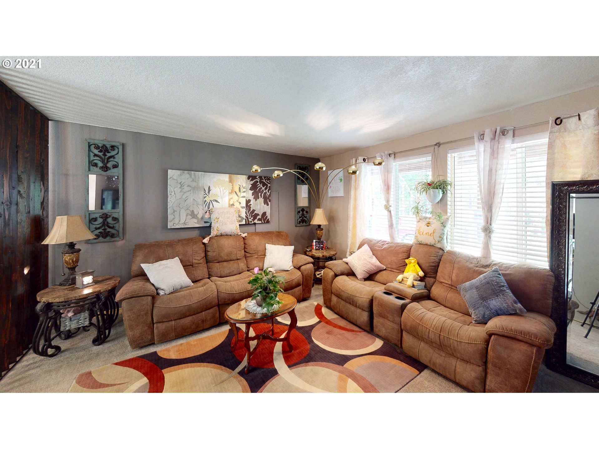 1803 Byron Creek Road Winston, OR 97496 - Photo 7 of 32 a living room with furniture a large window and a chandelier