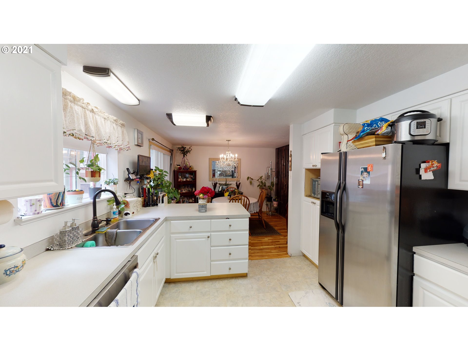1803 Byron Creek Road Winston, OR 97496 - Photo 9 of 32 a kitchen with a refrigerator and a sink