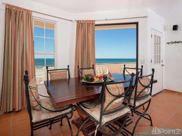 a view of a patio with table and chairs and potted plants