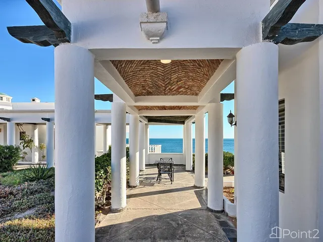 a view of a swimming pool with an outdoor space and seating area