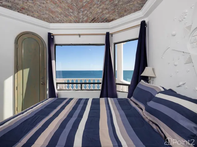 a bedroom with two beds and a chandelier