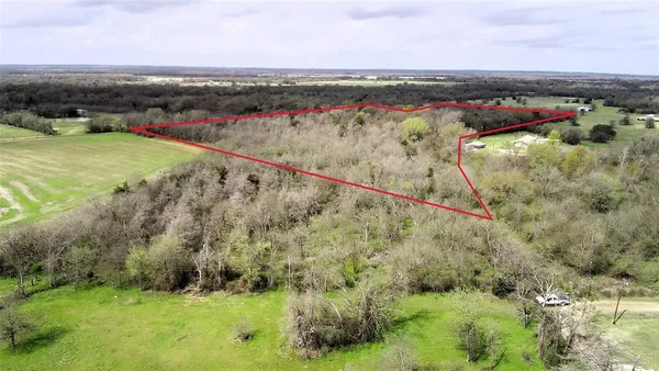 a view of a lake with a yard