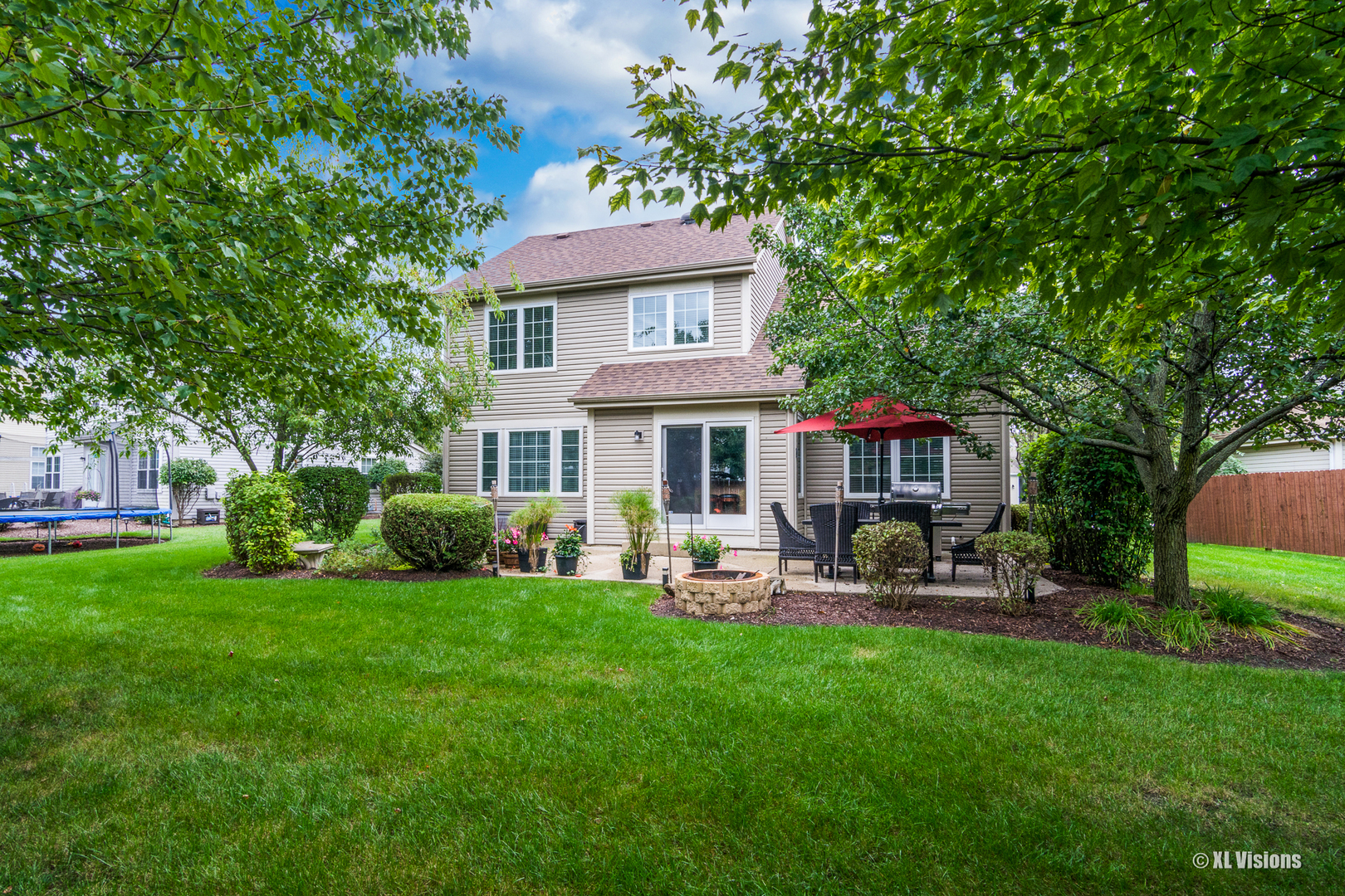 1360 Beacon Lane Bartlett, IL 60103 - Photo 23 of 26 a view of a house with a yard and sitting area