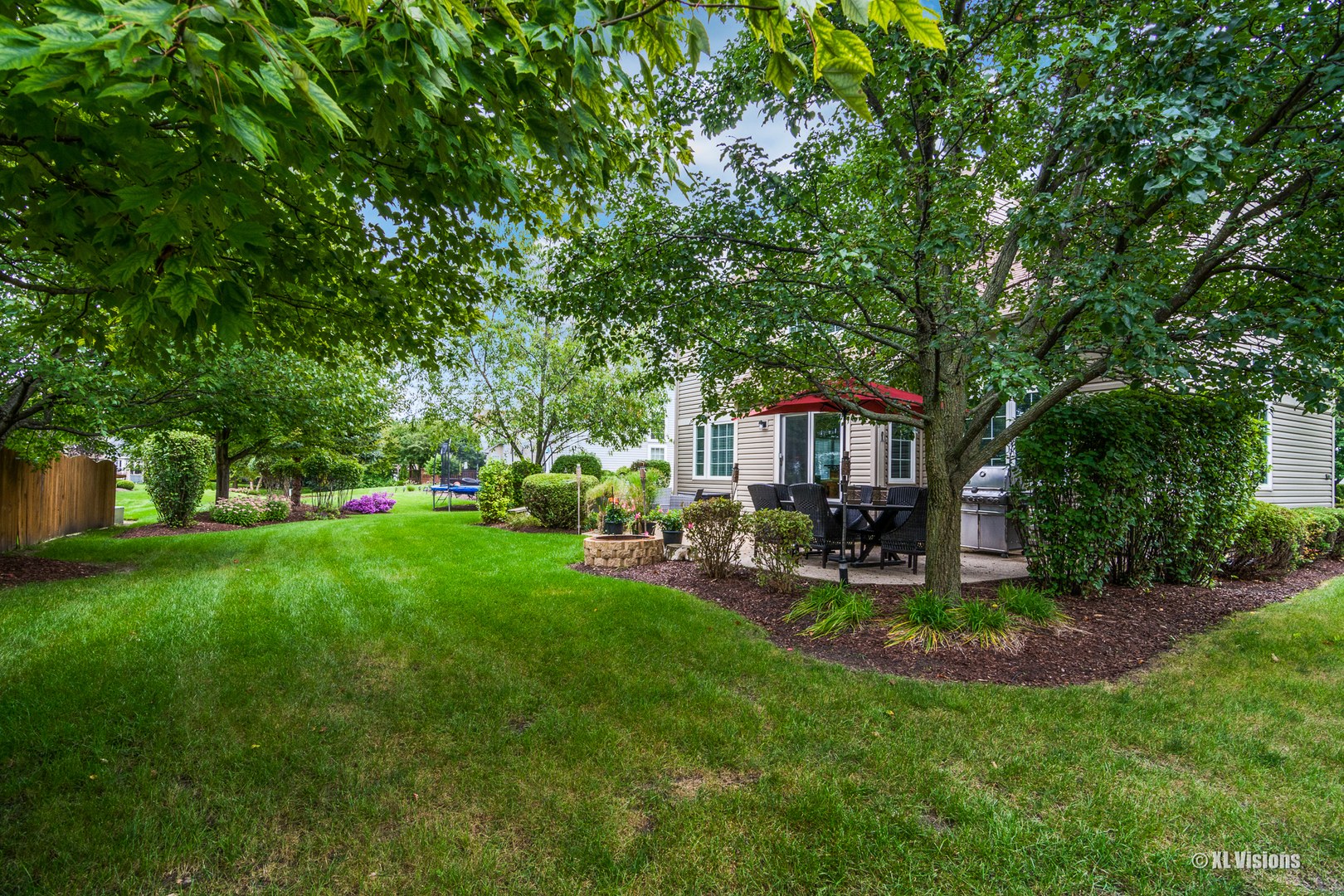 1360 Beacon Lane Bartlett, IL 60103 - Photo 24 of 26 a view of a chair and table in backyard