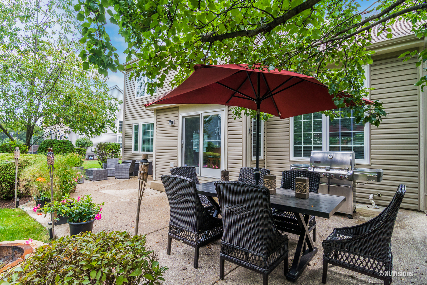 1360 Beacon Lane Bartlett, IL 60103 - Photo 26 of 26 a view of a house with backyard sitting area and garden