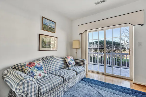 a bedroom with furniture and a window