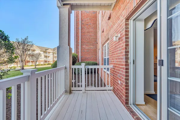 a view of a brick wall from a balcony