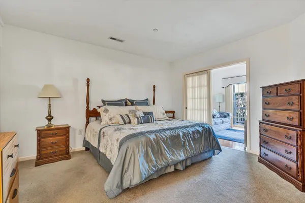 a bedroom with a bed and a cabinets