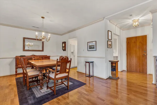 a view of a dining room with furniture and wooden floor
