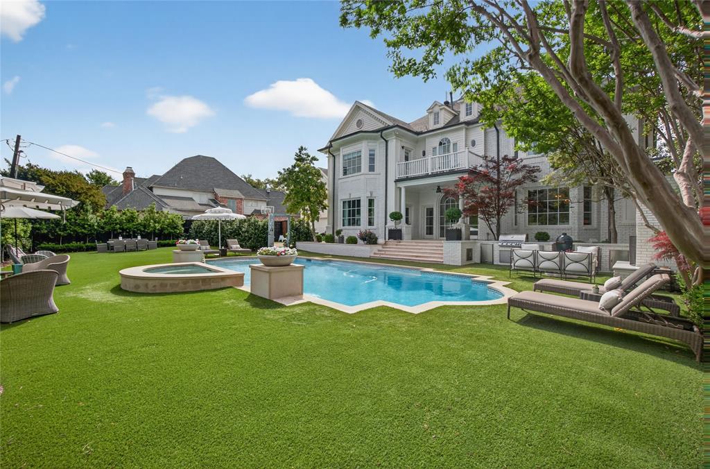 6331 Waggoner Drive Dallas, TX 75230 - Photo 27 of 36 a view of a house with swimming pool and porch with furniture