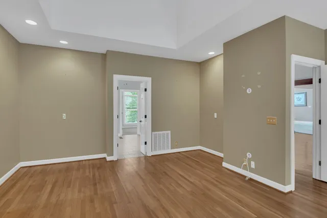 a kitchen with stainless steel appliances granite countertop stove a refrigerator a oven and a wooden cabinets