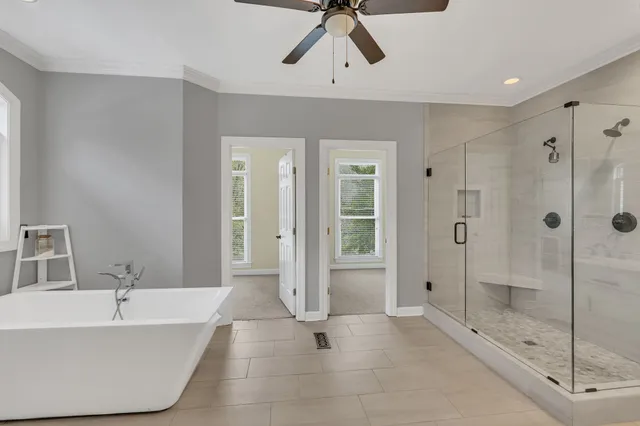 a kitchen with stainless steel appliances granite countertop a sink a stove and a wooden cabinets