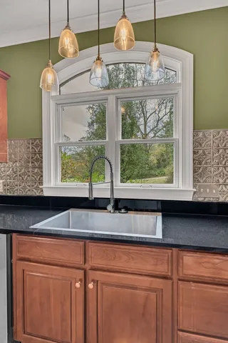 a view of a wooden deck next to a yard