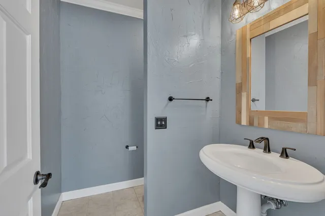 an aerial view of a house with a yard basket ball court and outdoor seating
