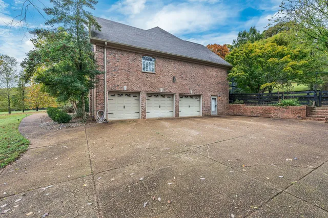 a lobby with furniture and floor to ceiling window and wooden floor