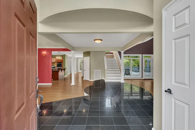 wooden floor in an empty room with a fireplace