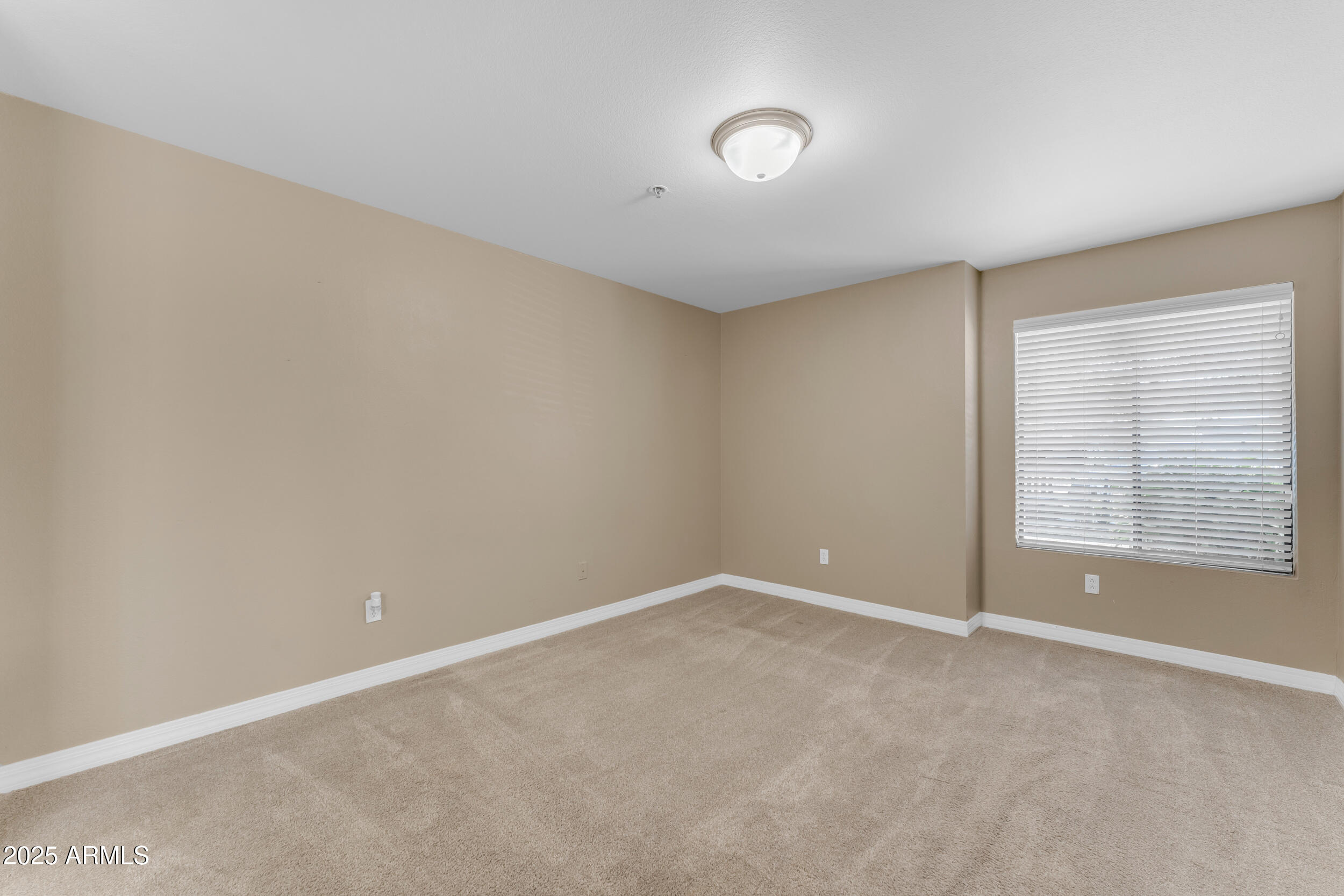 2025 East Campbell Avenue, Unit 140 Phoenix, AZ 85016 - Photo 20 of 52 a view of an empty room with a window