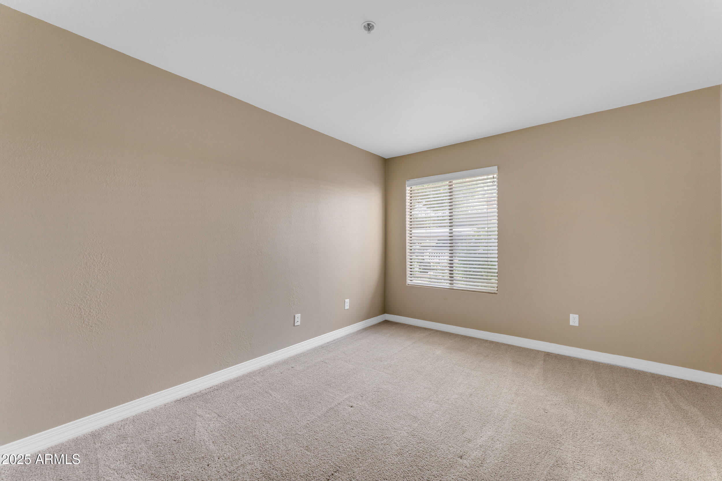 2025 East Campbell Avenue, Unit 140 Phoenix, AZ 85016 - Photo 29 of 52 a view of an empty room with a window
