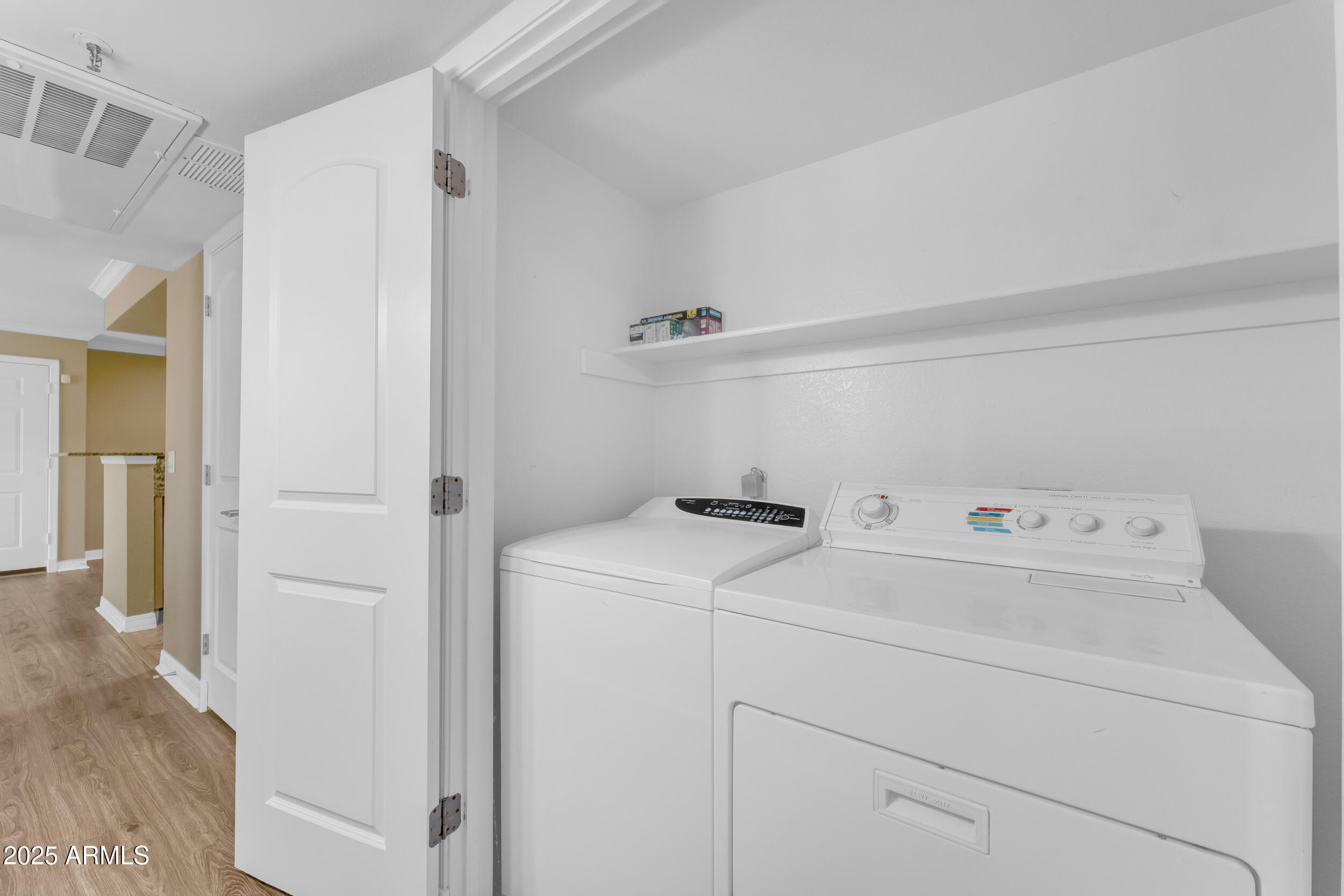 2025 East Campbell Avenue, Unit 140 Phoenix, AZ 85016 - Photo 33 of 52 a view of storage and utility room with washer and dryer