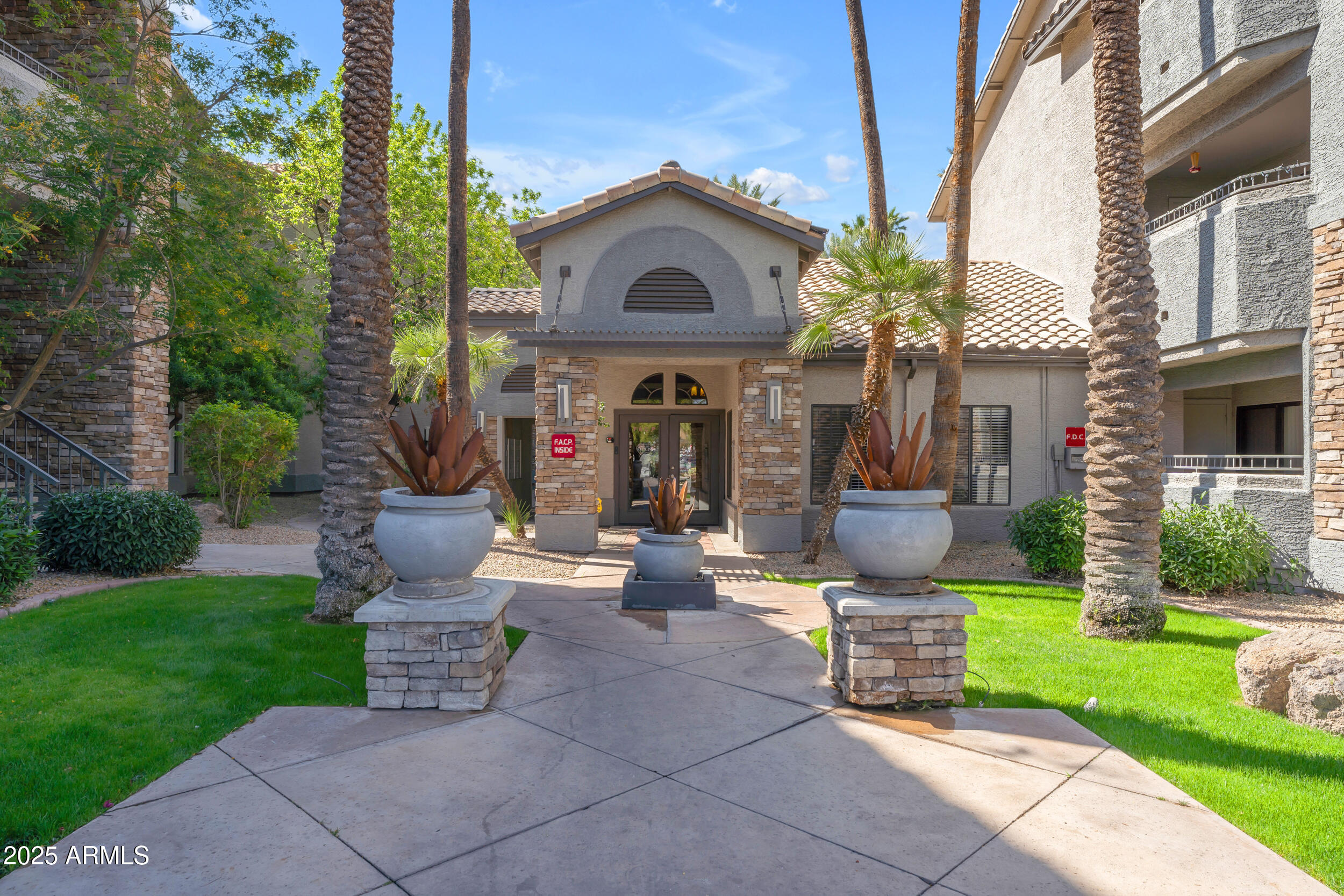2025 East Campbell Avenue, Unit 140 Phoenix, AZ 85016 - Photo 44 of 52 a front view of a house with garden and porch