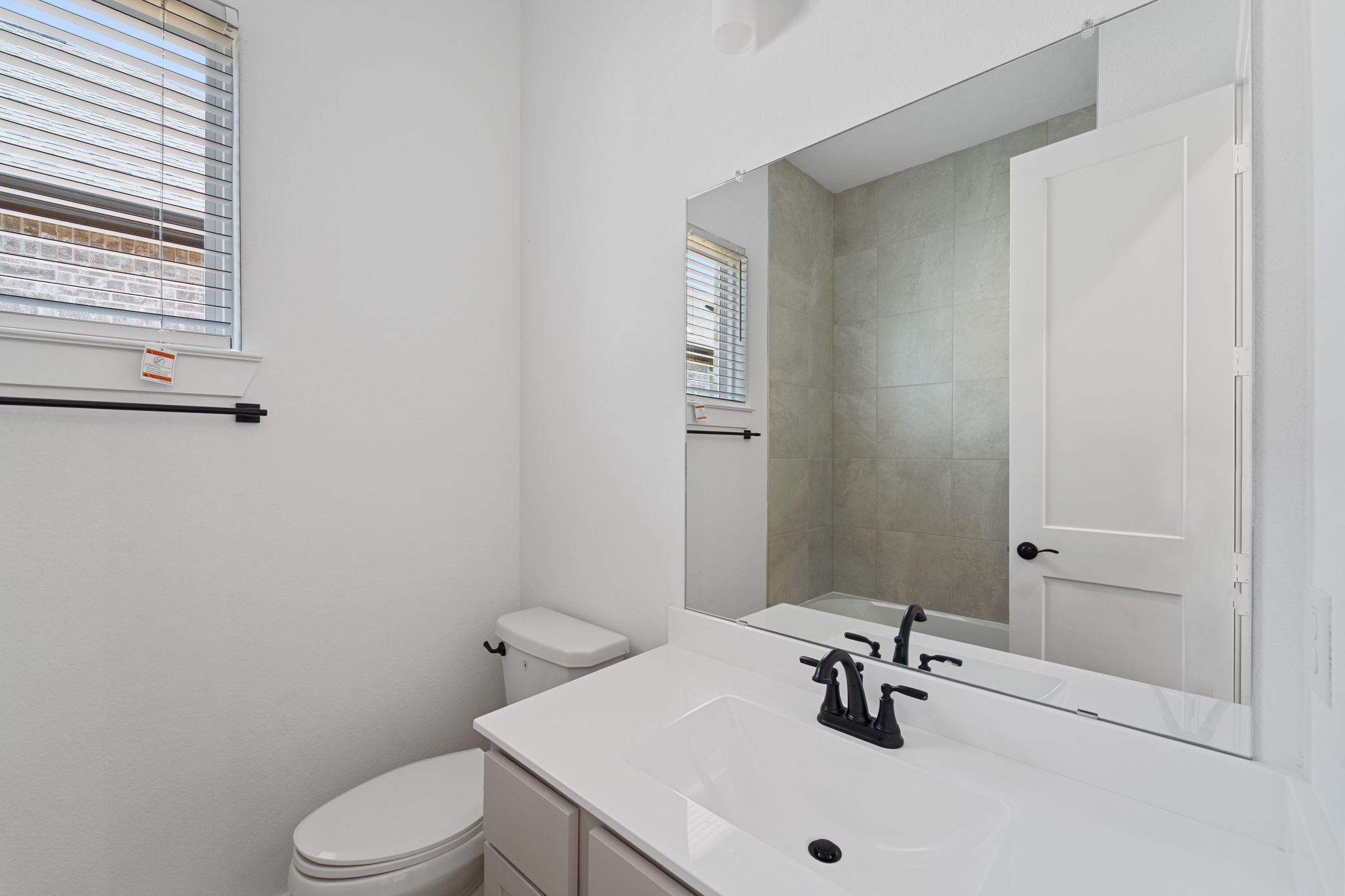 207 Blue River Trail Rosenberg, TX 77471 - Photo 13 of 38 a bathroom with a sink a toilet and shower