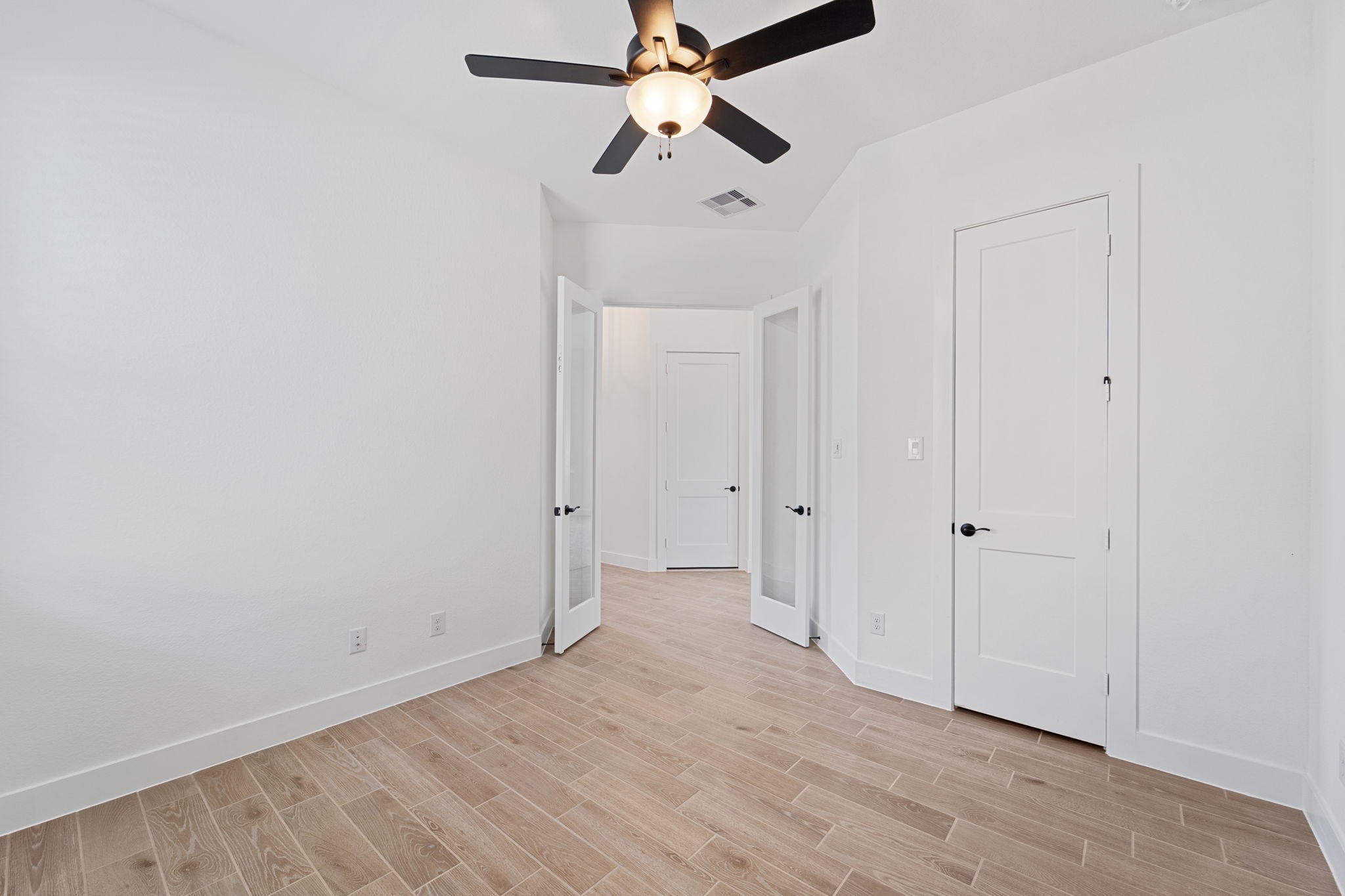 207 Blue River Trail Rosenberg, TX 77471 - Photo 14 of 38 wooden floor in an empty room