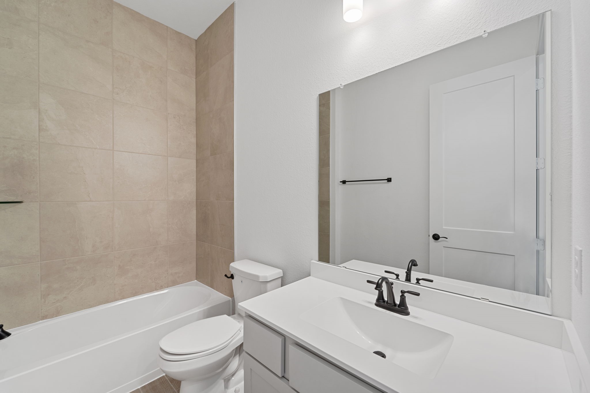 207 Blue River Trail Rosenberg, TX 77471 - Photo 16 of 38 a bathroom with a sink toilet and shower