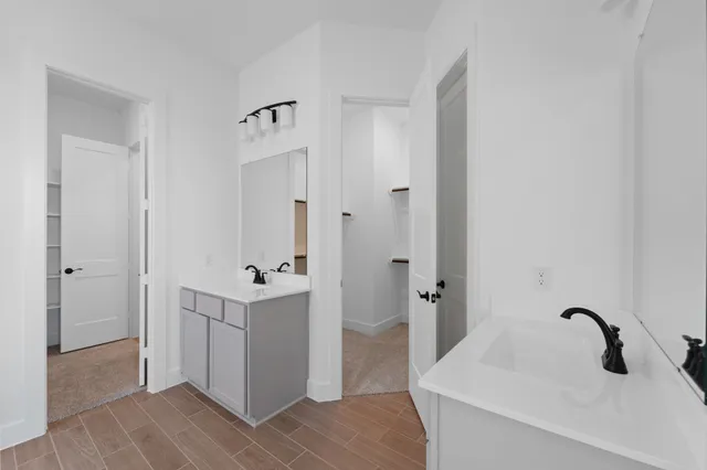 a bathroom with a shower and a sink