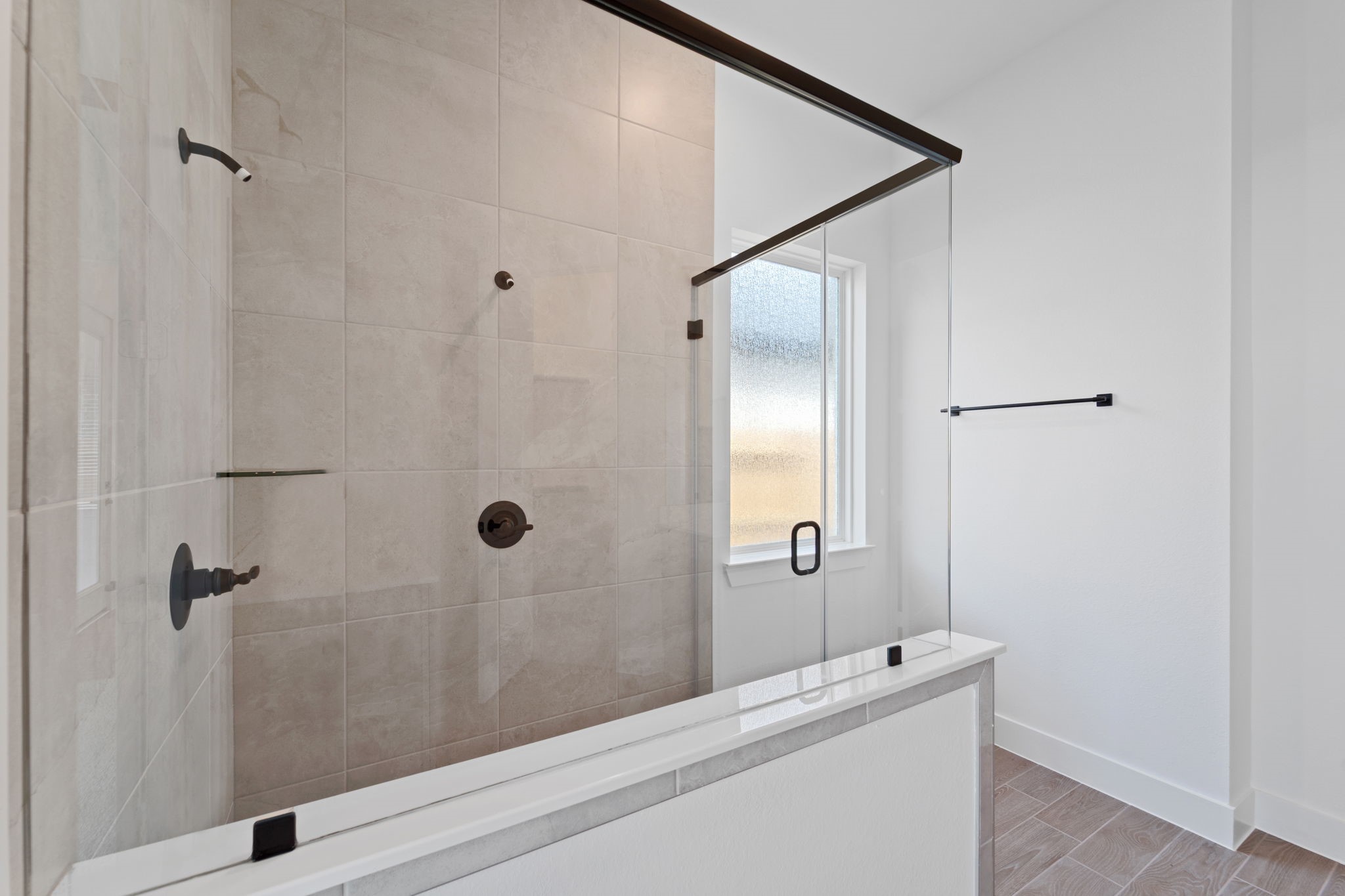 207 Blue River Trail Rosenberg, TX 77471 - Photo 24 of 38 a bathroom with a shower and a sink