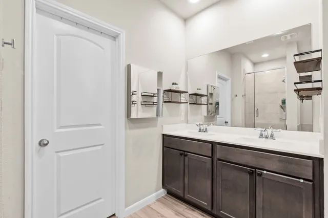 a kitchen with kitchen island a sink appliances and cabinets