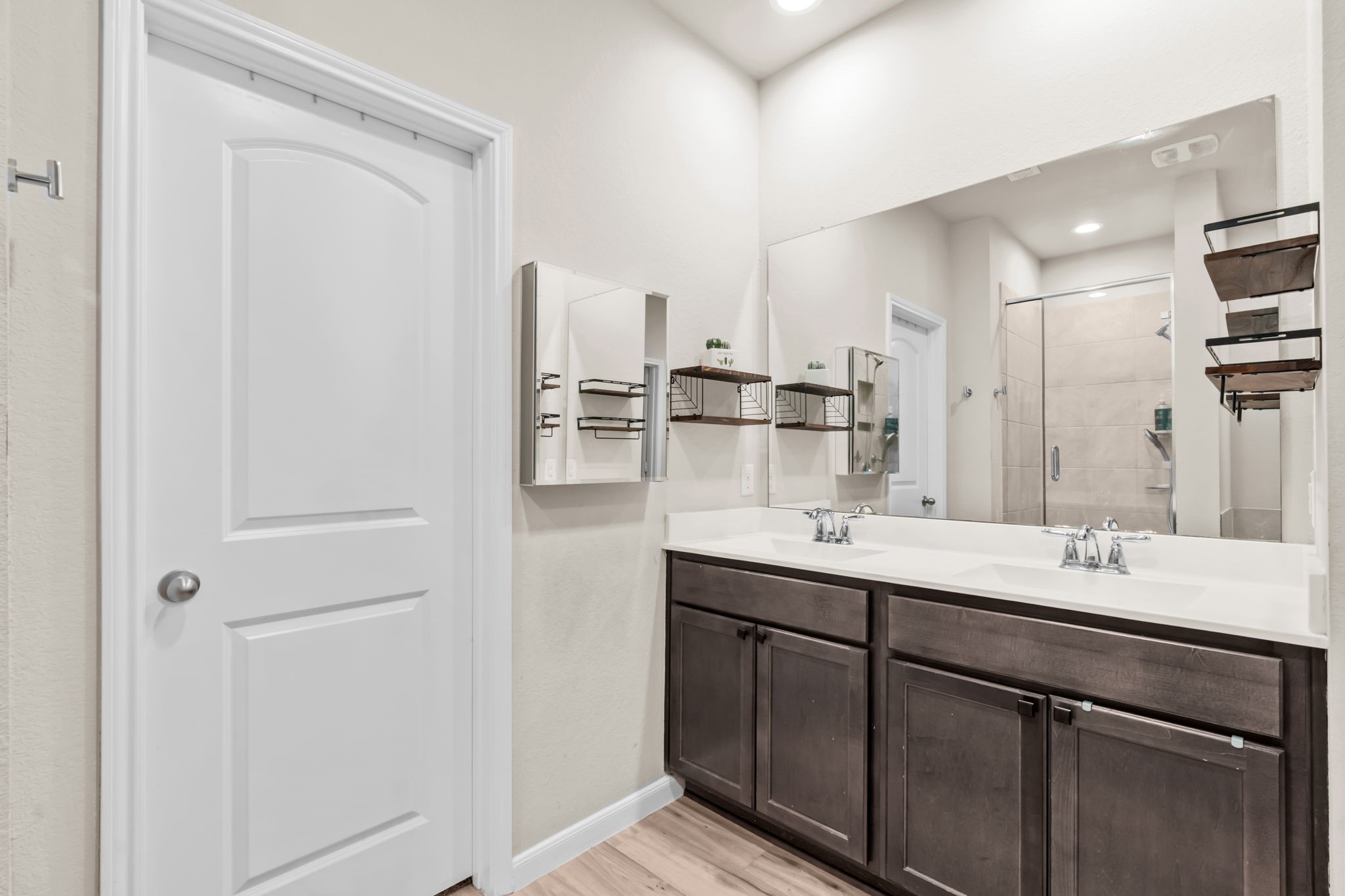 14388 Zion Gate Crossing Conroe, TX 77384 - Photo 17 of 34 a kitchen with kitchen island a sink appliances and cabinets