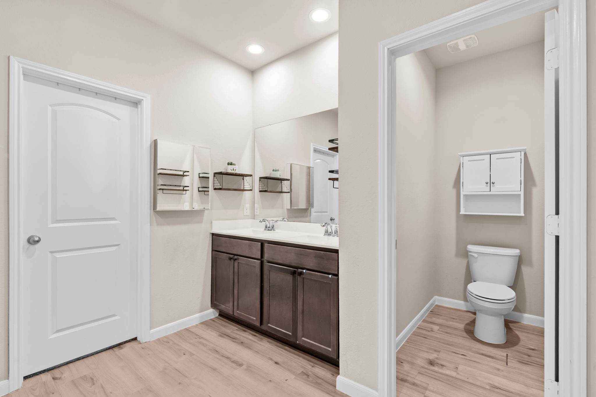 14388 Zion Gate Crossing Conroe, TX 77384 - Photo 18 of 34 a bathroom with a toilet sink and mirror