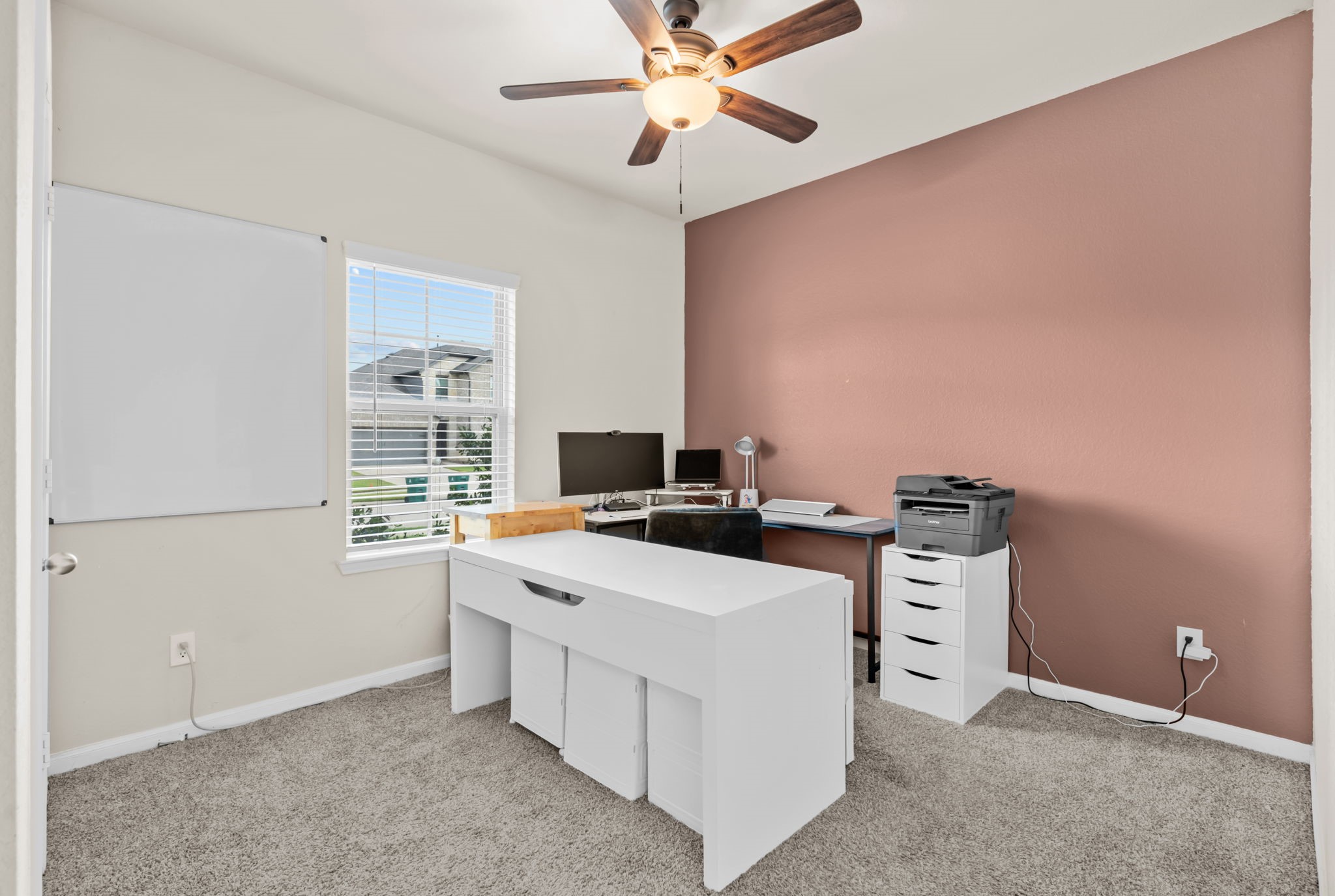 14388 Zion Gate Crossing Conroe, TX 77384 - Photo 19 of 34 a kitchen with a stove a sink and a refrigerator