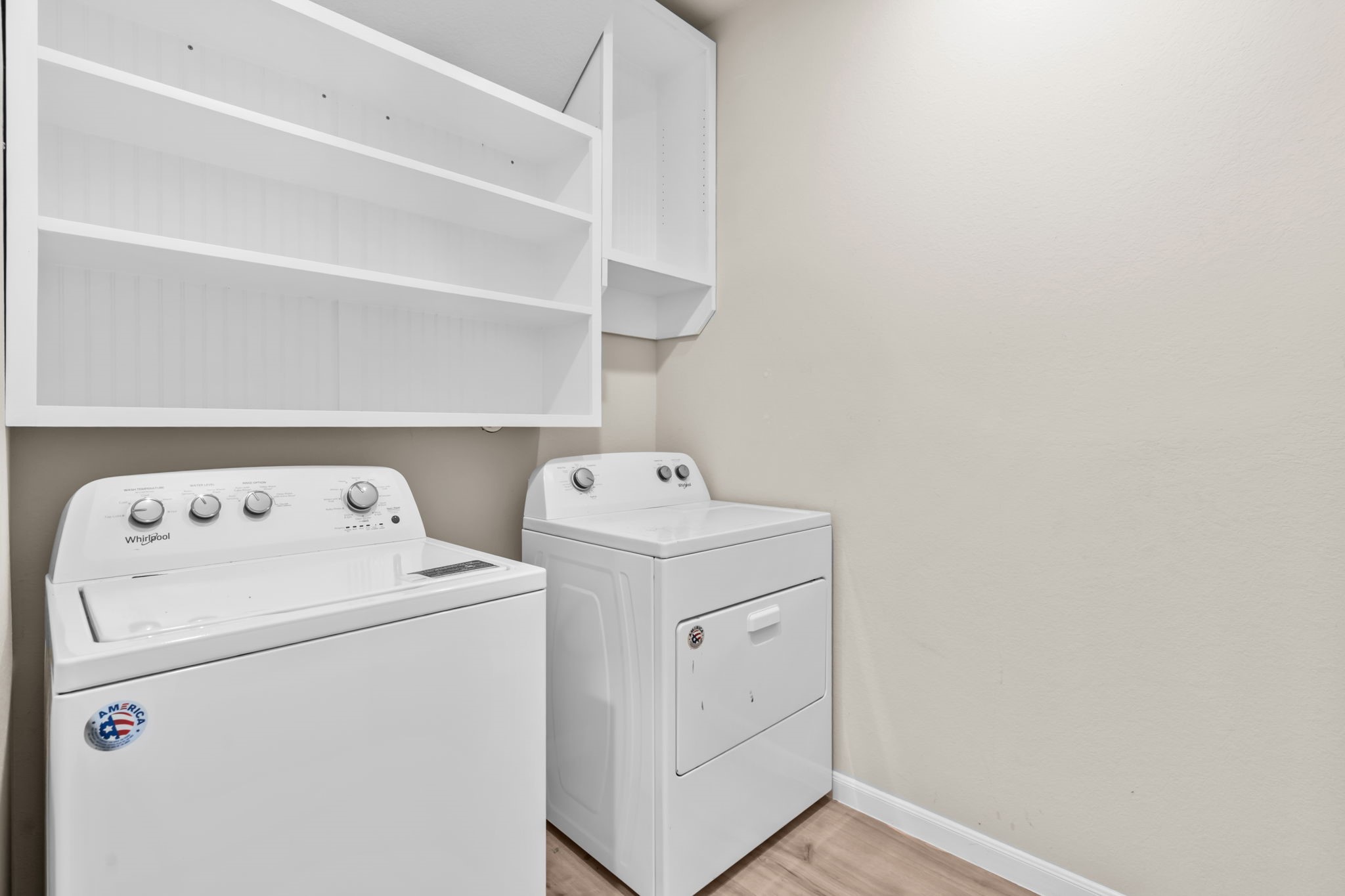 14388 Zion Gate Crossing Conroe, TX 77384 - Photo 21 of 34 a utility room with dryer and washer