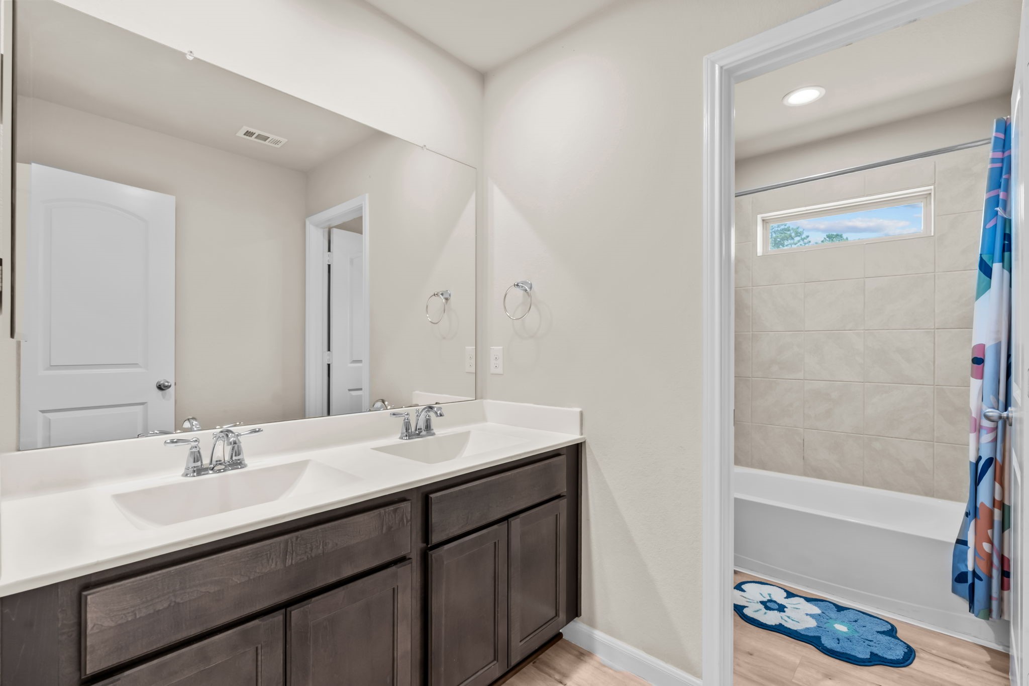 14388 Zion Gate Crossing Conroe, TX 77384 - Photo 26 of 34 a bathroom with a sink double vanity and tub