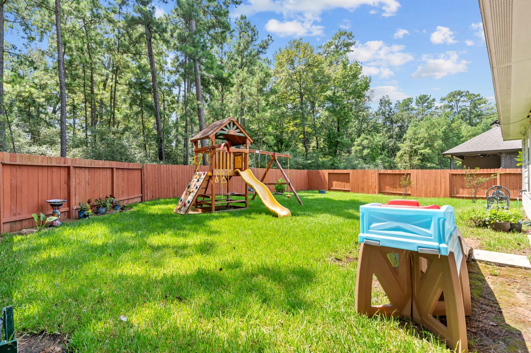14388 Zion Gate Crossing Conroe, TX 77384 - Photo 33 of 34 a view of a park with slide