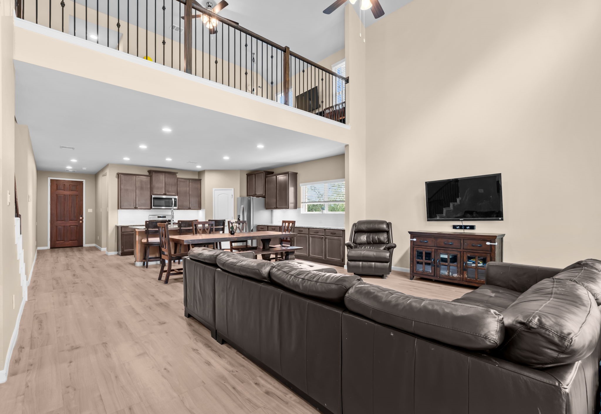 14388 Zion Gate Crossing Conroe, TX 77384 - Photo 9 of 34 a living room with furniture and a flat screen tv