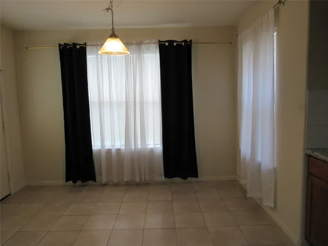 a view of a windows and chandelier in a room