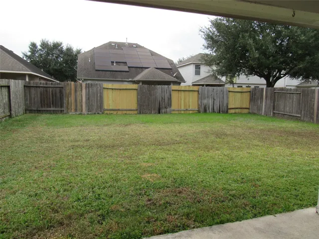 a view of a back yard of the house