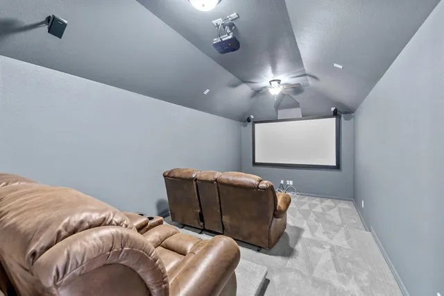 a bedroom with a bed and chandelier