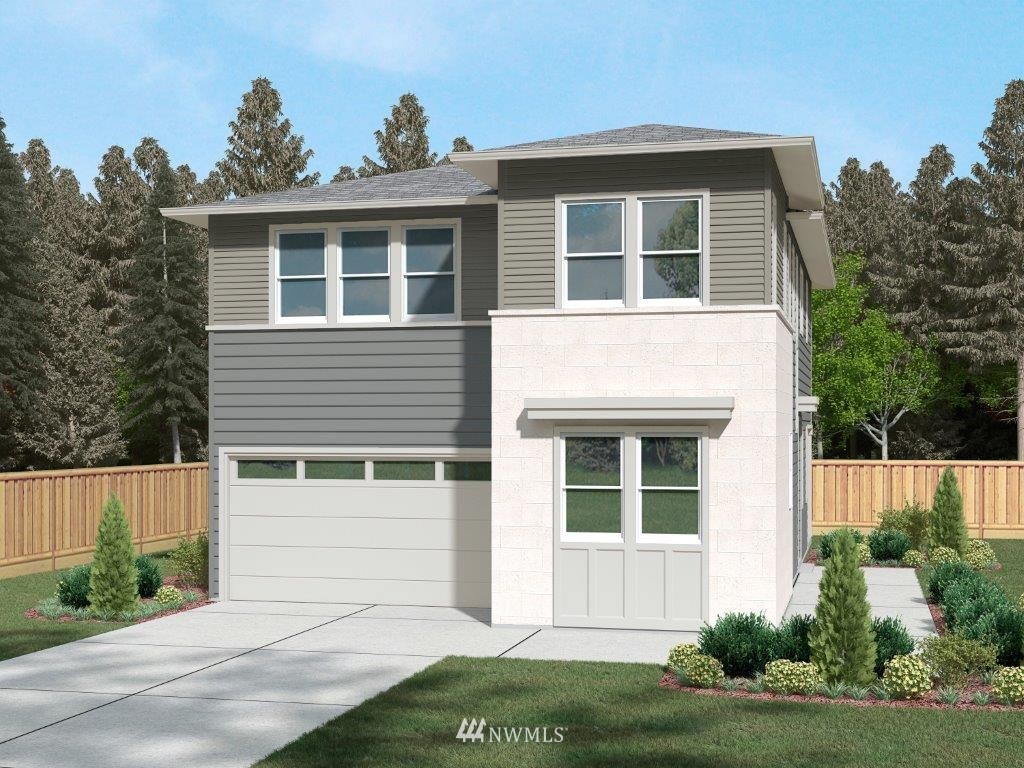 4325 Lot Place Southeast, Unit 14 223 Bothell, WA 98021 - Photo 1 of 14 a front view of a house with a yard and garage