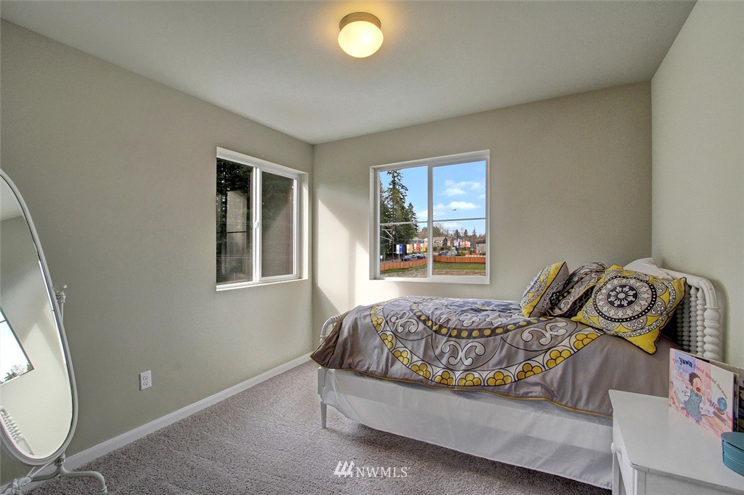 4325 Lot Place Southeast, Unit 14 223 Bothell, WA 98021 - Photo 11 of 14 a bedroom with a bed and a window