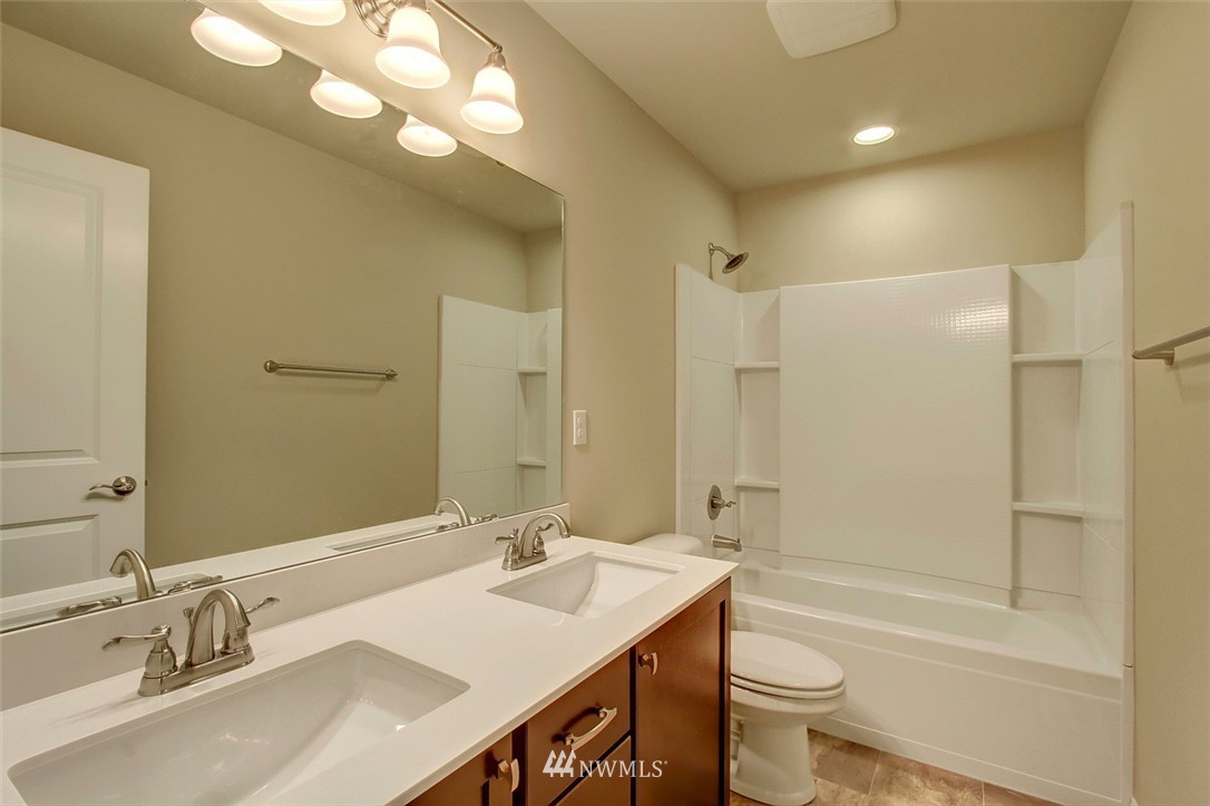 4325 Lot Place Southeast, Unit 14 223 Bothell, WA 98021 - Photo 12 of 14 a bathroom with a sink a toilet and shower