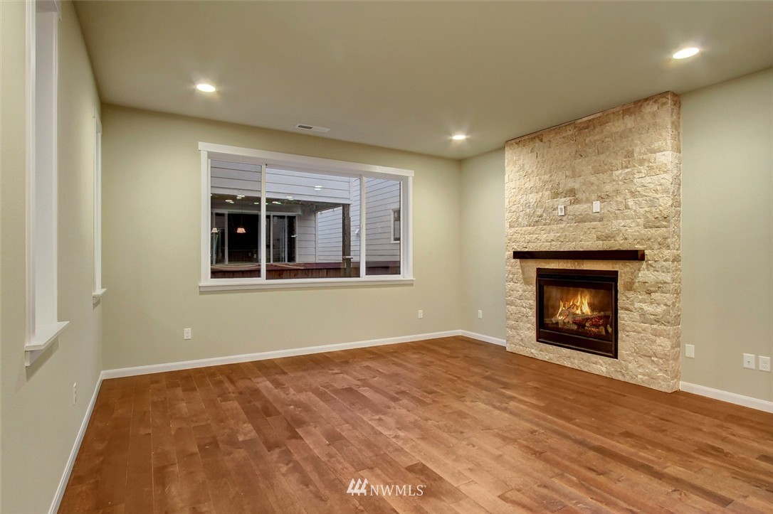 4325 Lot Place Southeast, Unit 14 223 Bothell, WA 98021 - Photo 3 of 14 a view of an empty room with a window and fireplace