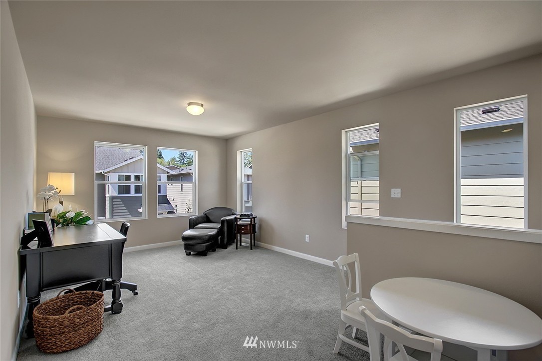 4325 Lot Place Southeast, Unit 14 223 Bothell, WA 98021 - Photo 5 of 14 a living room with furniture and a window
