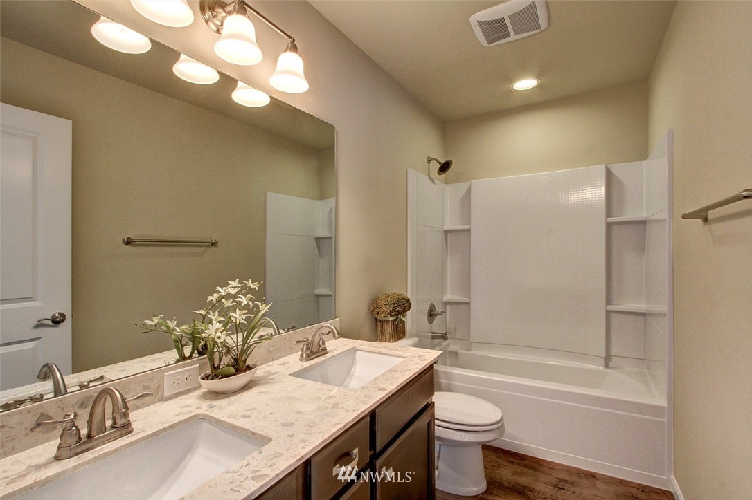 4325 Lot Place Southeast, Unit 14 223 Bothell, WA 98021 - Photo 6 of 14 a bathroom with a granite countertop sink toilet and shower
