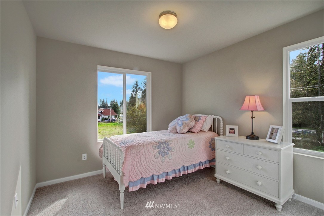 4325 Lot Place Southeast, Unit 14 223 Bothell, WA 98021 - Photo 10 of 14 a bedroom with a bed and a window