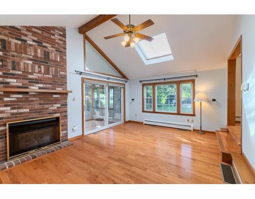 34 Brox Road Dracut, MA 01826 - Photo 11 of 35 a view of an empty room with a fireplace and a window