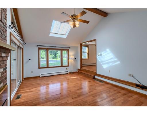 34 Brox Road Dracut, MA 01826 - Photo 12 of 35 a view of an empty room with wooden floor and a window
