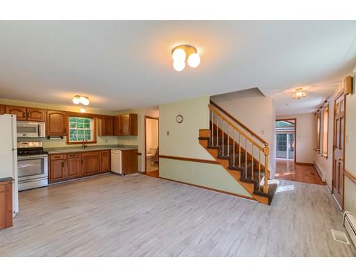 34 Brox Road Dracut, MA 01826 - Photo 2 of 35 a view of kitchen with furniture and wooden floor